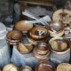 brown wooden round container on gray wooden table